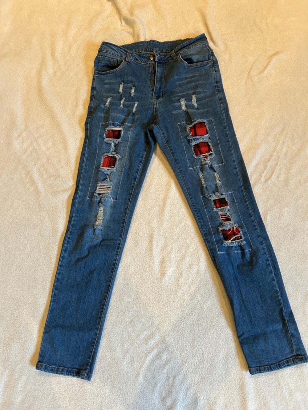 A Stylish Women Jeans with Red Plaid Patch